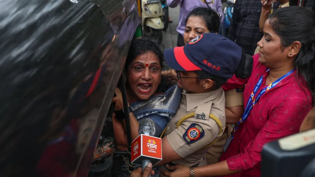 Police in Mumbai detain a woman who was participating in a protest this week against alleged injustice to Marathi speakers